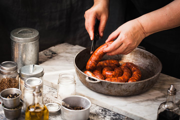 Fresh sausage in skillet pan. 