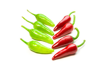 Many ripe red and green Chilli peppers on white