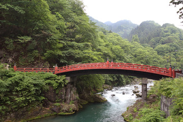 Red Bridge on decorate of garden and canal on Japanese style east asia