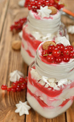 Dessert with red currant and whipped cream