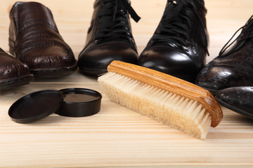 Brush and cream for footwear. Close-up