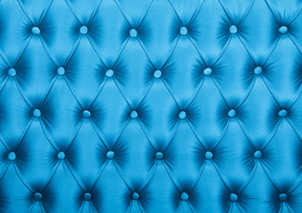 Fototapeta na wymiar Blue capitone tufted fabric upholstery texture
