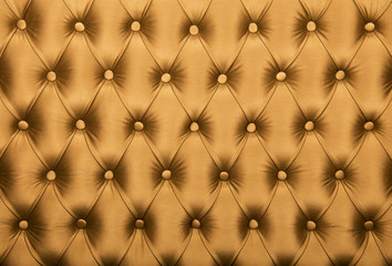Golden capitone tufted fabric upholstery texture