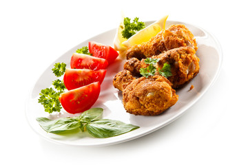 Roasted chicken drumsticks and vegetables 