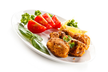 Roasted chicken drumsticks and vegetables 