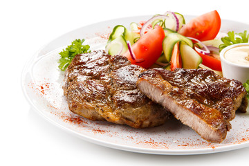 Grilled steaks on white background 