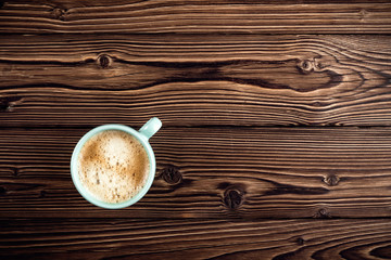 coffee cup on wooden background top view