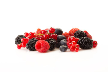 mixed black and red fruit on a white background