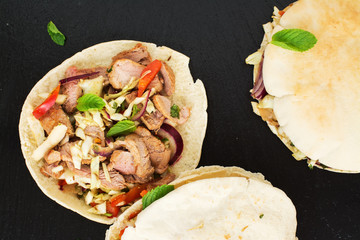 Greek pita bread with meat and salad
