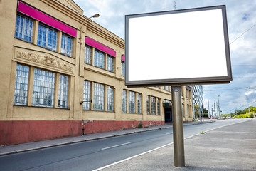 Empty street with blank billboard and old building. Space for promotion.