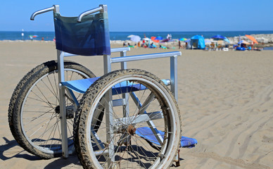 Fototapeta premium Wheelchair on the sandy beach