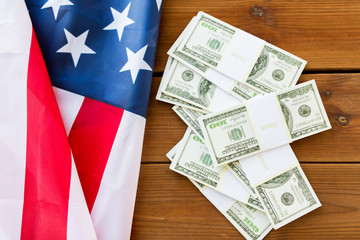 close up of american flag and dollar cash money