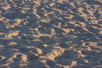 Lines in the sand of a beach with sunlight in morning. Close up image can use background and texture or template design in nature background