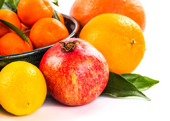 Fresh fruits and berries isolated on white