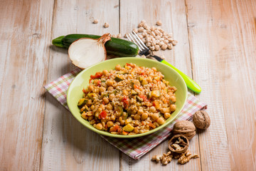 barley risotto with zucchinis chickpeas nuts and tomatoes