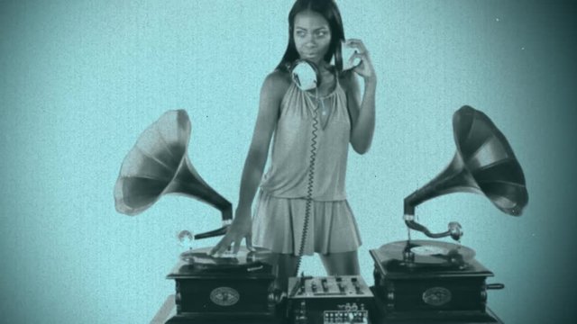 woman dj using two retro antique gramophones