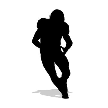 American football player running with ball in hand and dribbles.