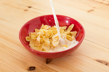 A bowl of Corn flakes with milk.