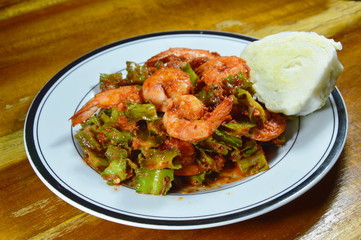spicy stir fried wing bean with shrimp in curry on dish