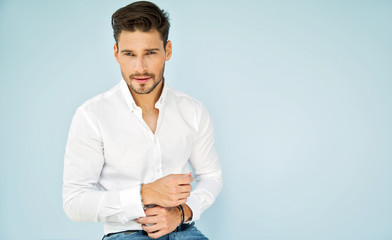 Portrait of handsome male model in white shirt