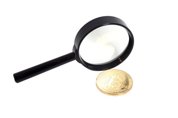 Magnifier glass with golden bitcoin coin isolated on white backg
