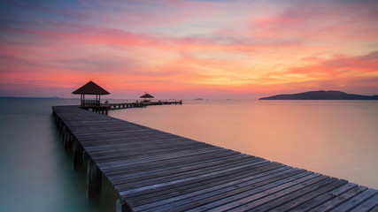 Fototapeta na wymiar Wooden pier between sunset in Phuket