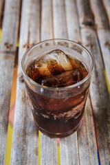 Soft drinks in glass on bamboo table