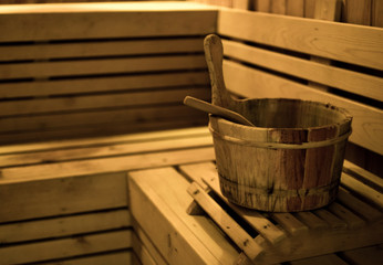 sauna bucket in wooden sauna room.