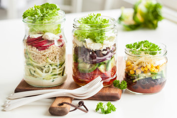 healthy vegetable cheese salad in mason jars