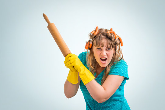 Mad And Crazy Housewife Woman With Kitchen Roller