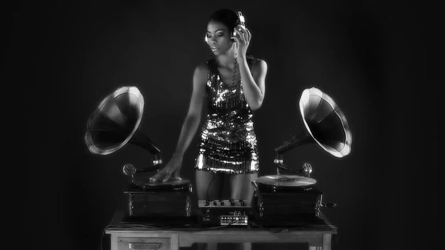 young woman djs using retro antique gramophones