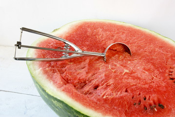Cutting out balls of watermelon for a snack