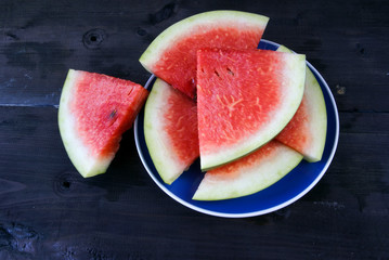 Sliced watermelon on a wooden table