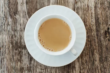 Crédence de cuisine en verre imprimé Theé milk tea on a wooden table