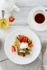 Morning toasts with fruits and coffee