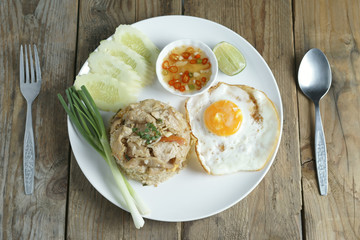Pork fried rice and fried egg with vegetable.Pork fried rice and