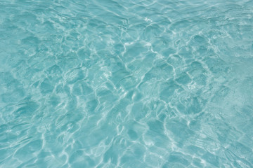 Shining light and reflections of blue water