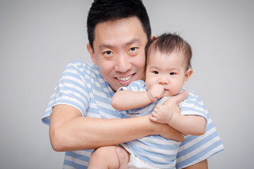 Asian father with his child