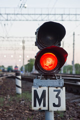 red semaphore signal on railway in summer time