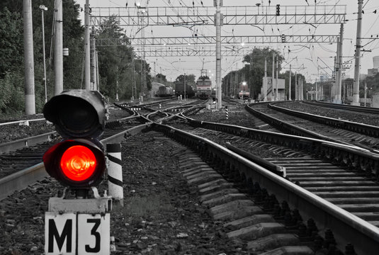 red semaphore signal on railway in the summer