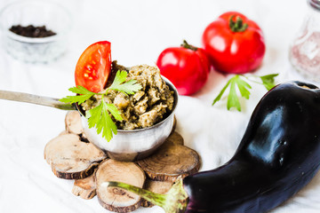 Traditional arabian eggplant dip baba ganoush in a metal bowl