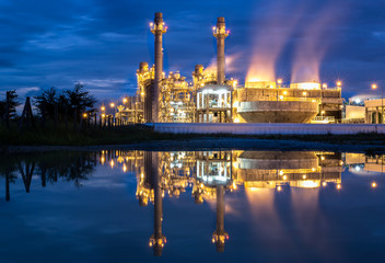 Gas turbine power plant with blue sky and reflection
