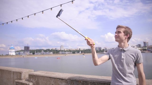 Man Takes Selfie in city, urban landscape. 1080p