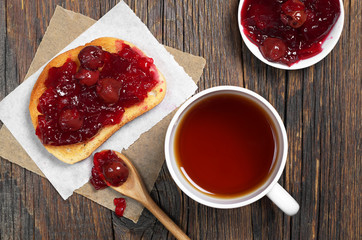 Toast with cherry jam and tea