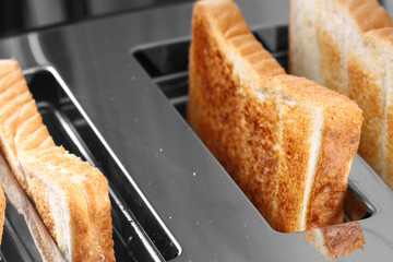 Toast in toaster / Slices of toast in a toaster - obrazy, fototapety, plakaty