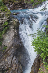 Alpine waterfall in mountain forest