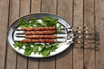 Kebab of minced beef on the tray.