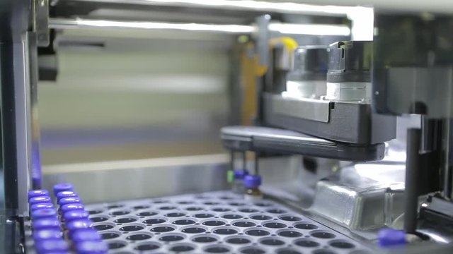 Modern science laboratory with test tubes and robotic tools or equipment. 