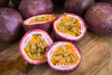 Fresh passion fruits on a wooden background