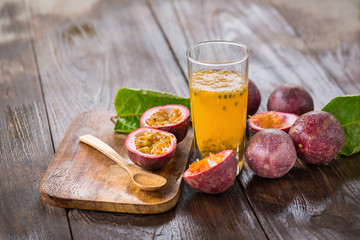 Fresh passion fruits on a wooden background
